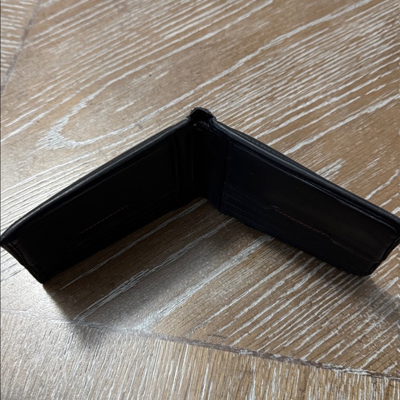 Tumi Black Leather Wallet— 
Serial # 421505